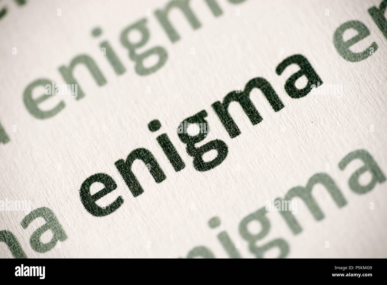 word enigma printed on white paper macro Stock Photo Alamy