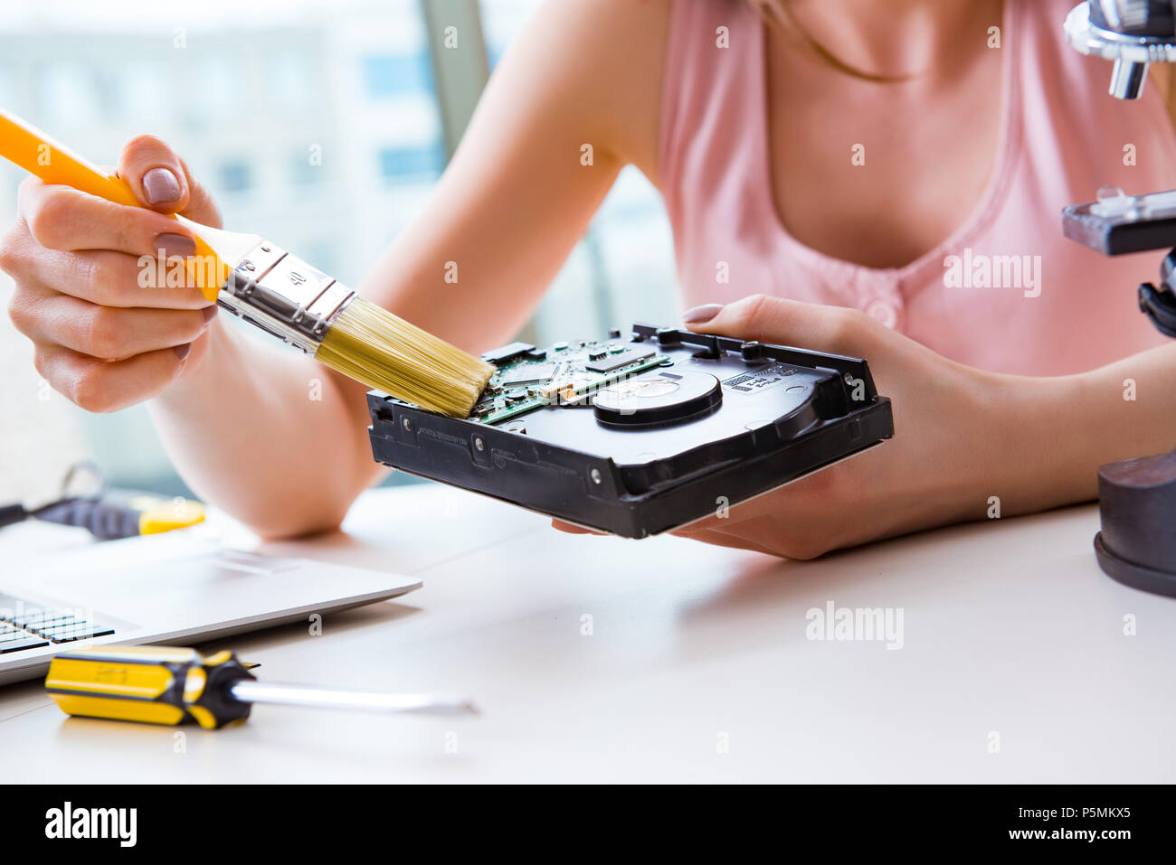 View of Hard drive repair and data recovery with restoration Stock Photo - Alamy