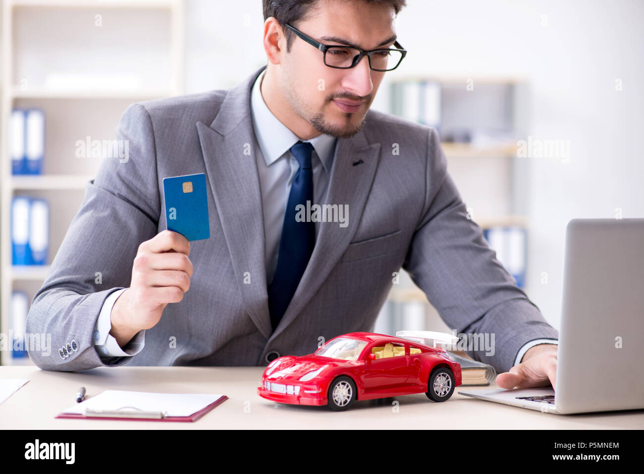 Agent offering car motor insurance Stock Photo Alamy