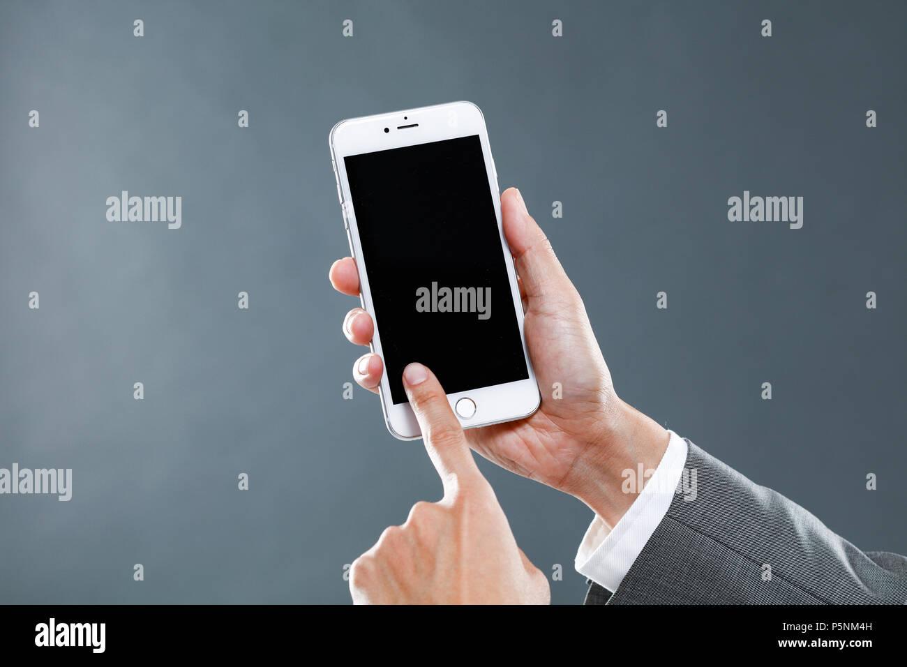 Hands holding smartphone Stock Photo