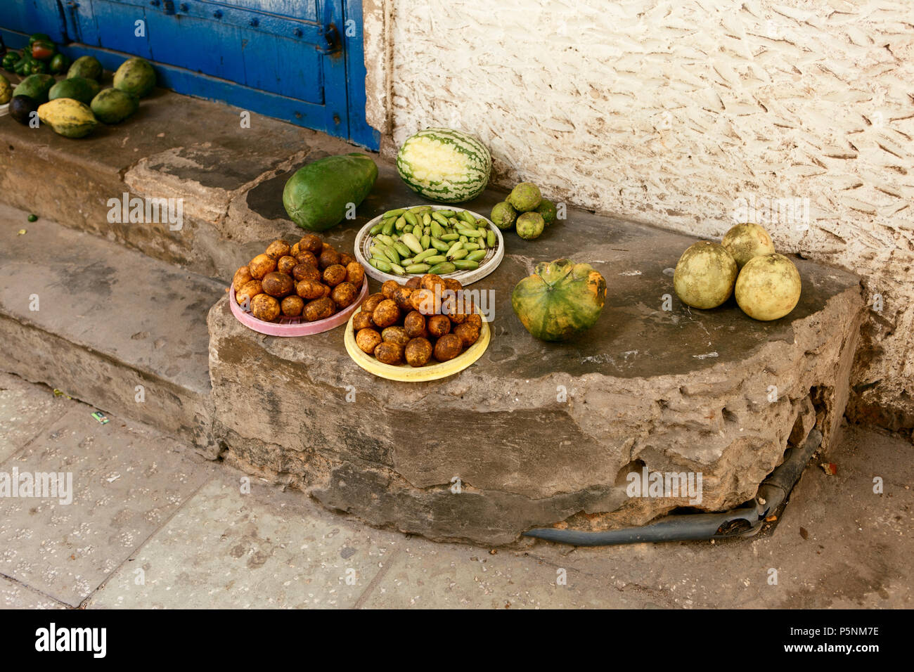 African fruits in unsanitary conditions at African market Stock Photo