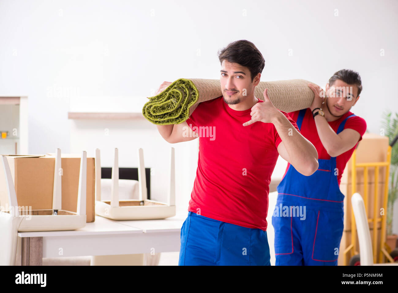 Two contractor employees moving personal belongings Stock Photo Alamy