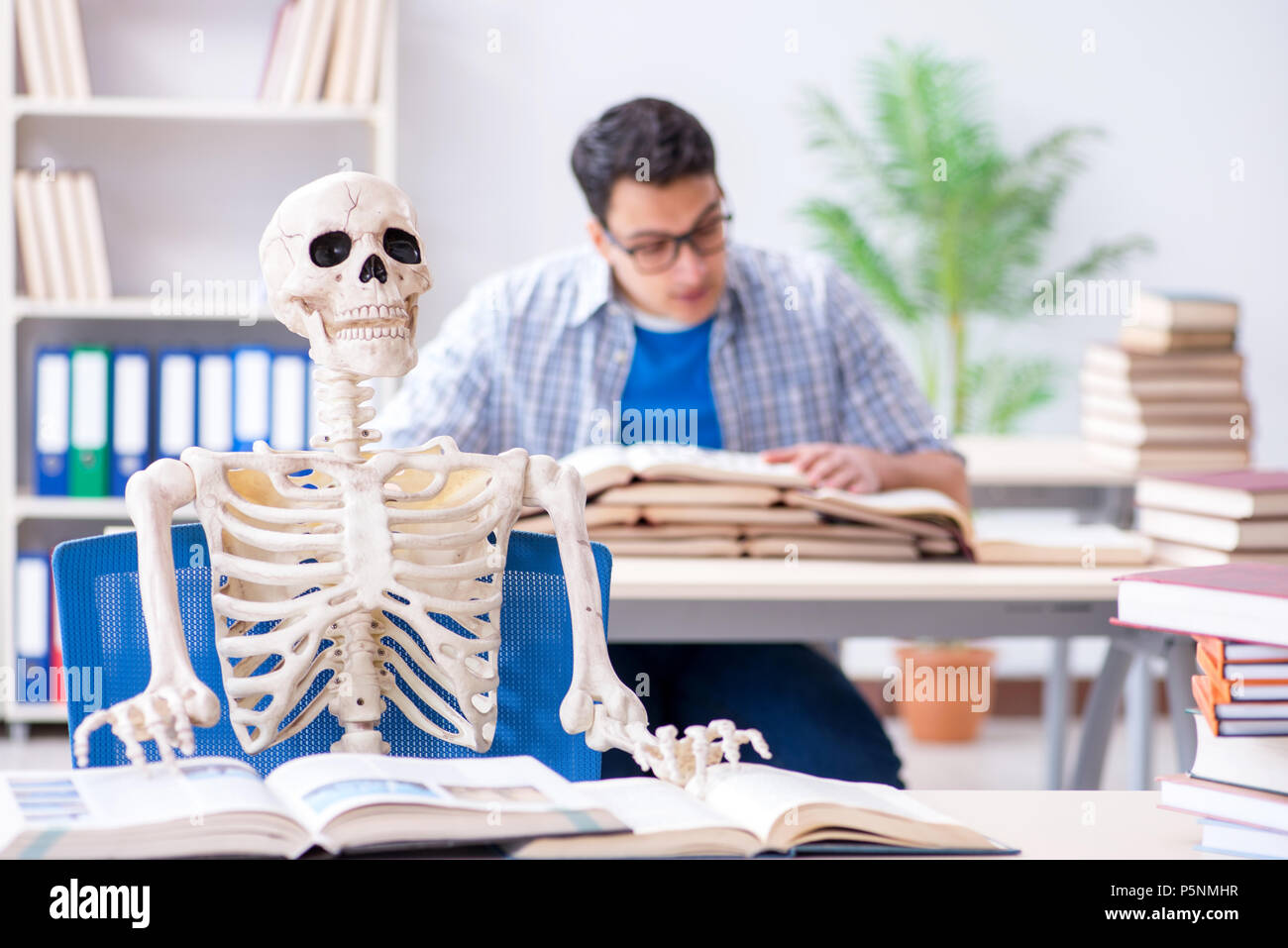 student-skeleton-listening-to-lecture-in-classroom-P5NMHR.jpg