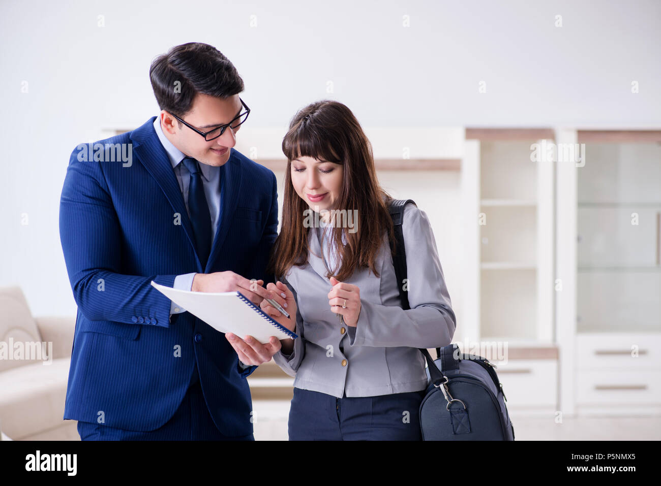 Real estate agent showing new apartment to owner Stock Photo Alamy