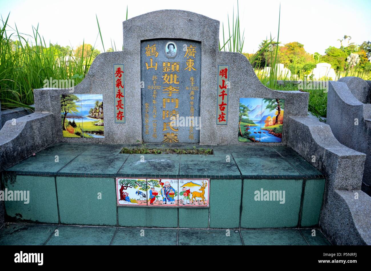 Chinese grave tombstone with photograph and painted artistic tiles Ipoh