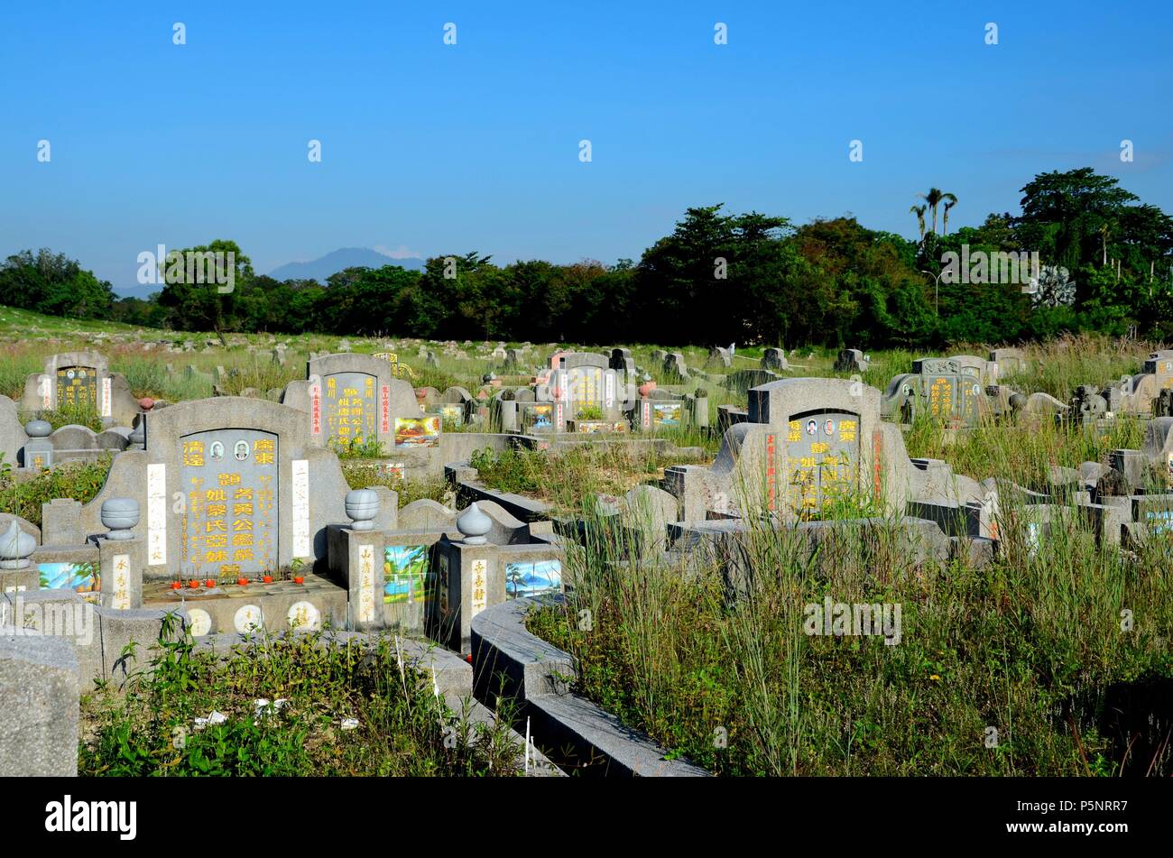 General view of large Chinese graveyard cemetery with graves and tombstones Ipoh Malaysia Stock