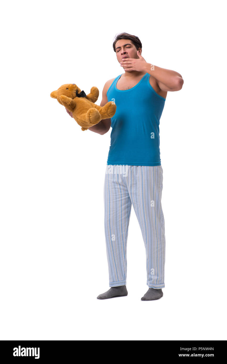 Young man in pajamas with toy animal isolated on white background Stock Photo