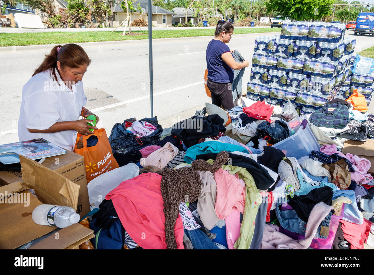 Florida,Bonita Springs,after Hurricane Irma storm damage destruction aftermath,disaster relief recovery,donations distribution site point,Hispanic wom Stock Photo