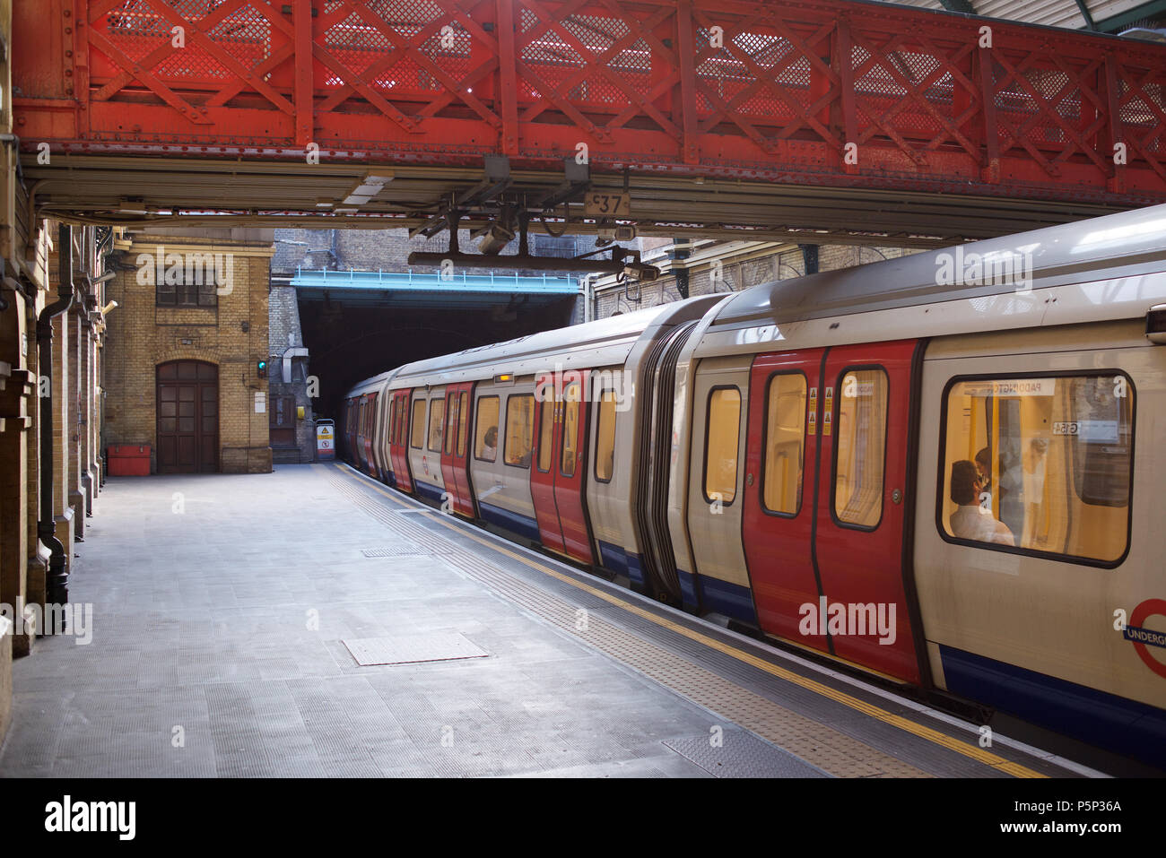District Line train at Paddington Underground station in London Stock