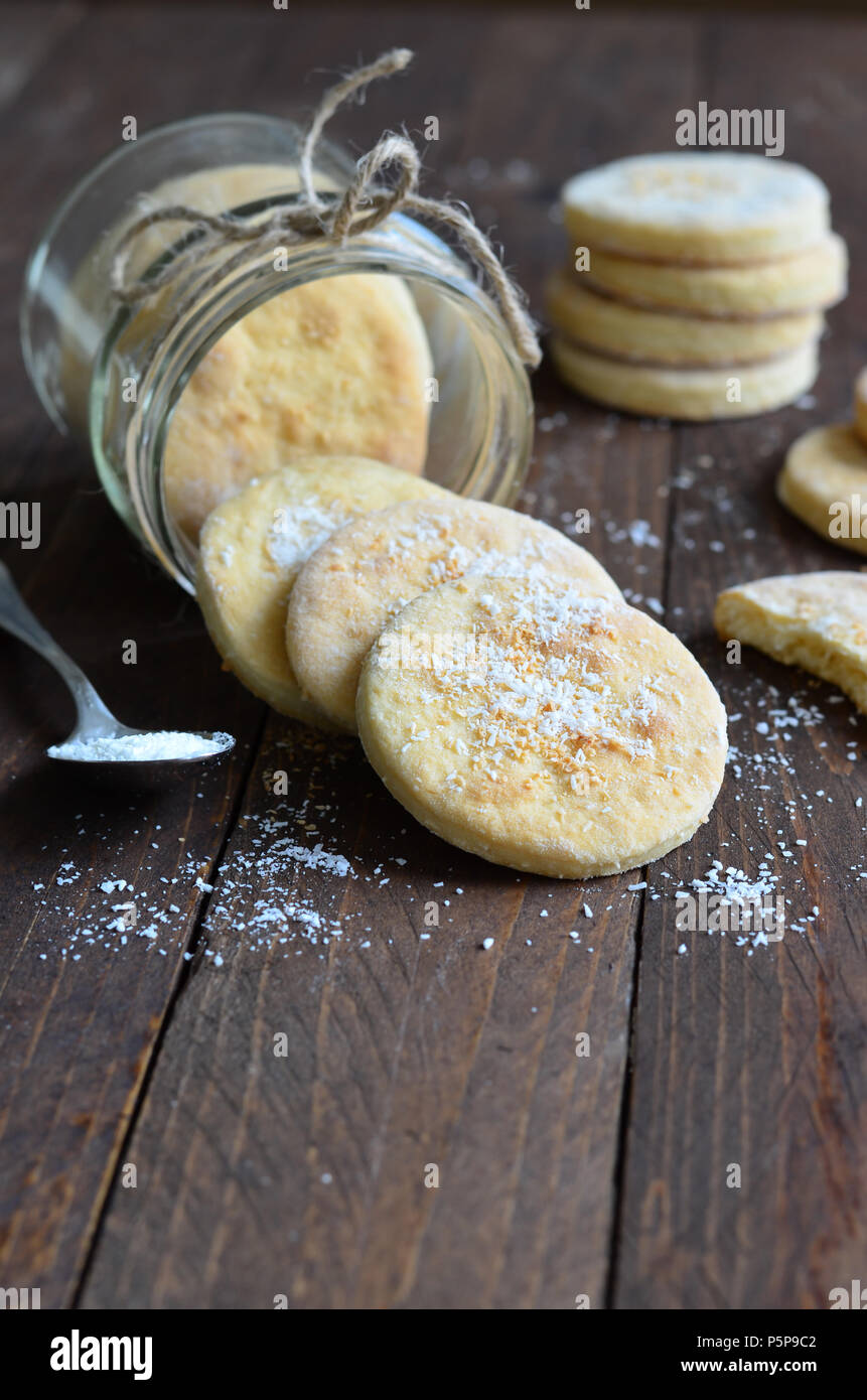 Homemade Coconut cookies on dark wooden background Stock Photo