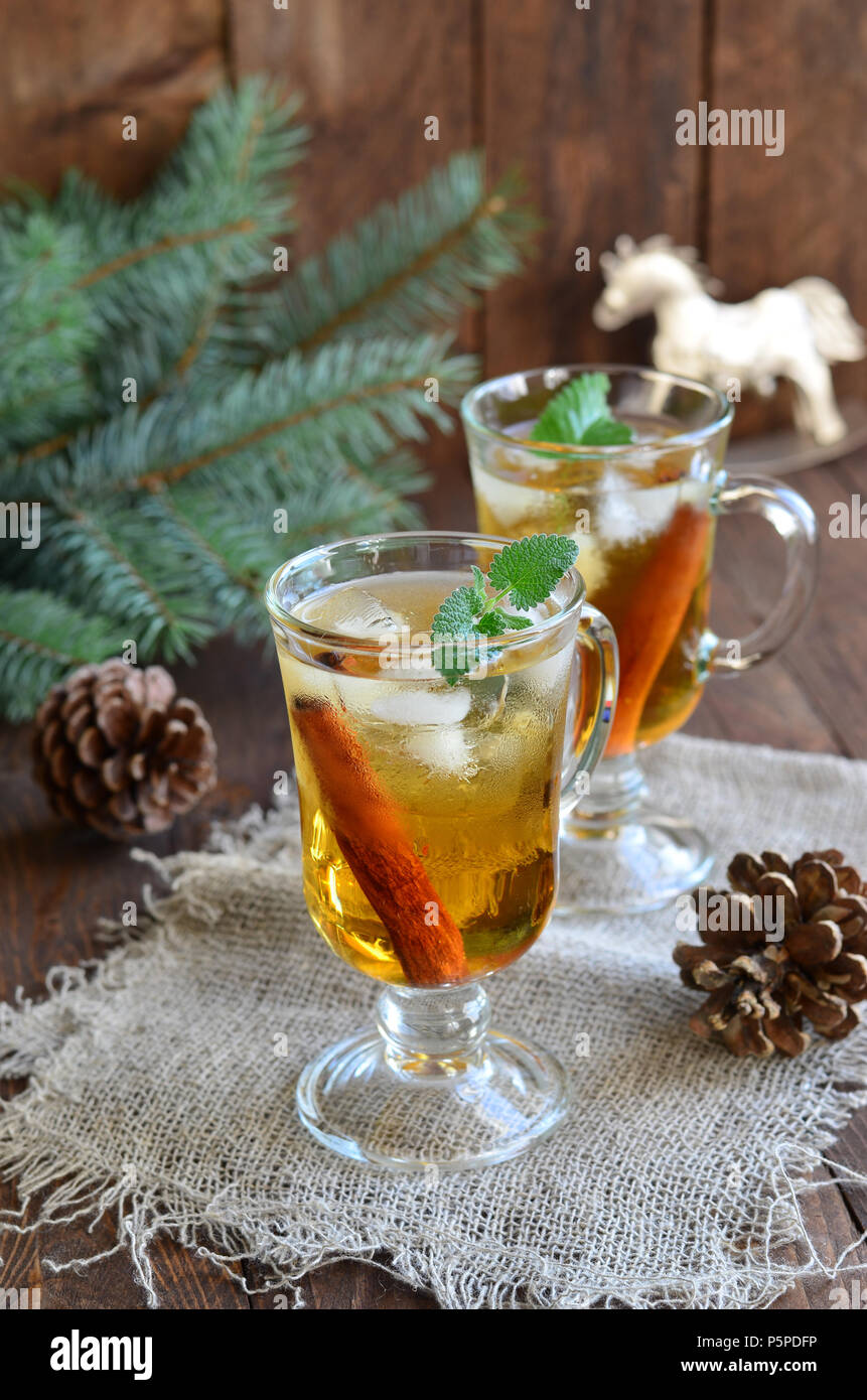 Whiskey cocktail with cinnamon on Christmas background Stock Photo Alamy