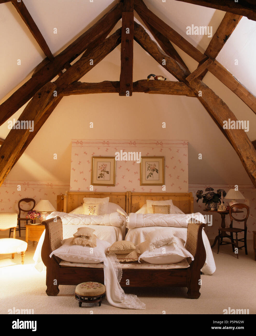 High, beamed apex ceiling in French country bedroom with sofa at High, beamed apex ceiling in French country bedroom with sofa at