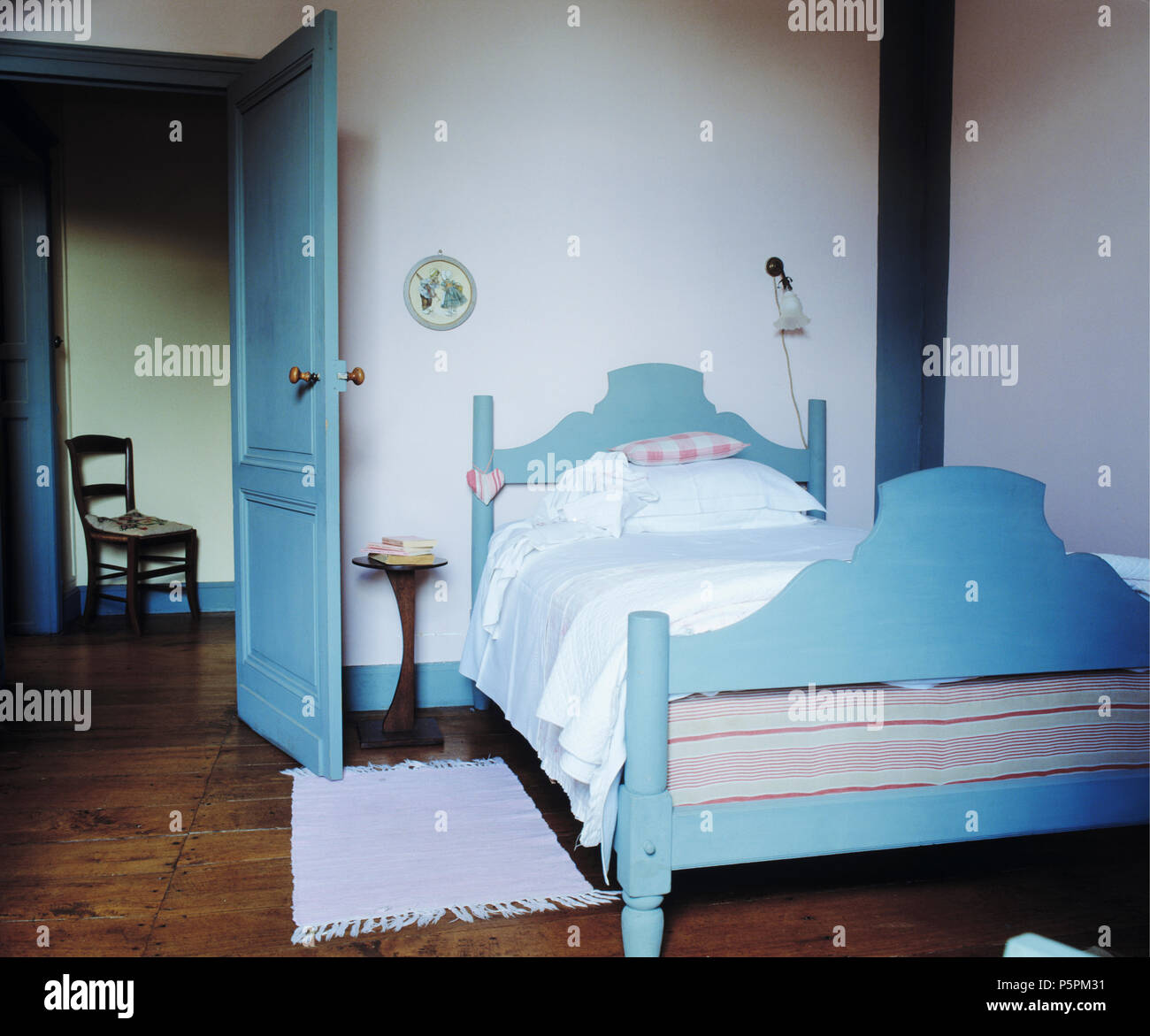 Pale Blue Painted Wooden Bed In Simple White French Country