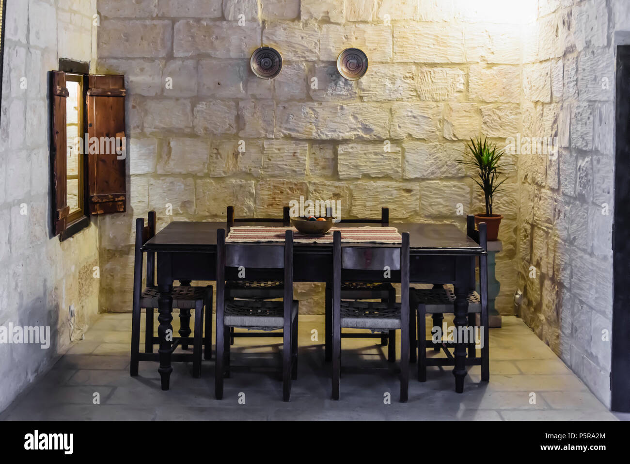 Traditional Maltese dining table in a house. Stock Photo