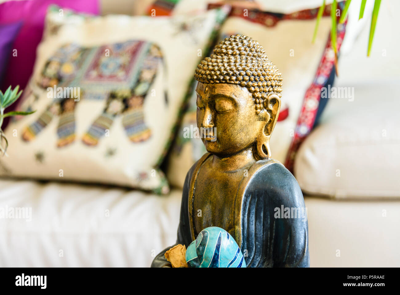 Statue Of Contemplating Buddha Inside A Modern Trendy House