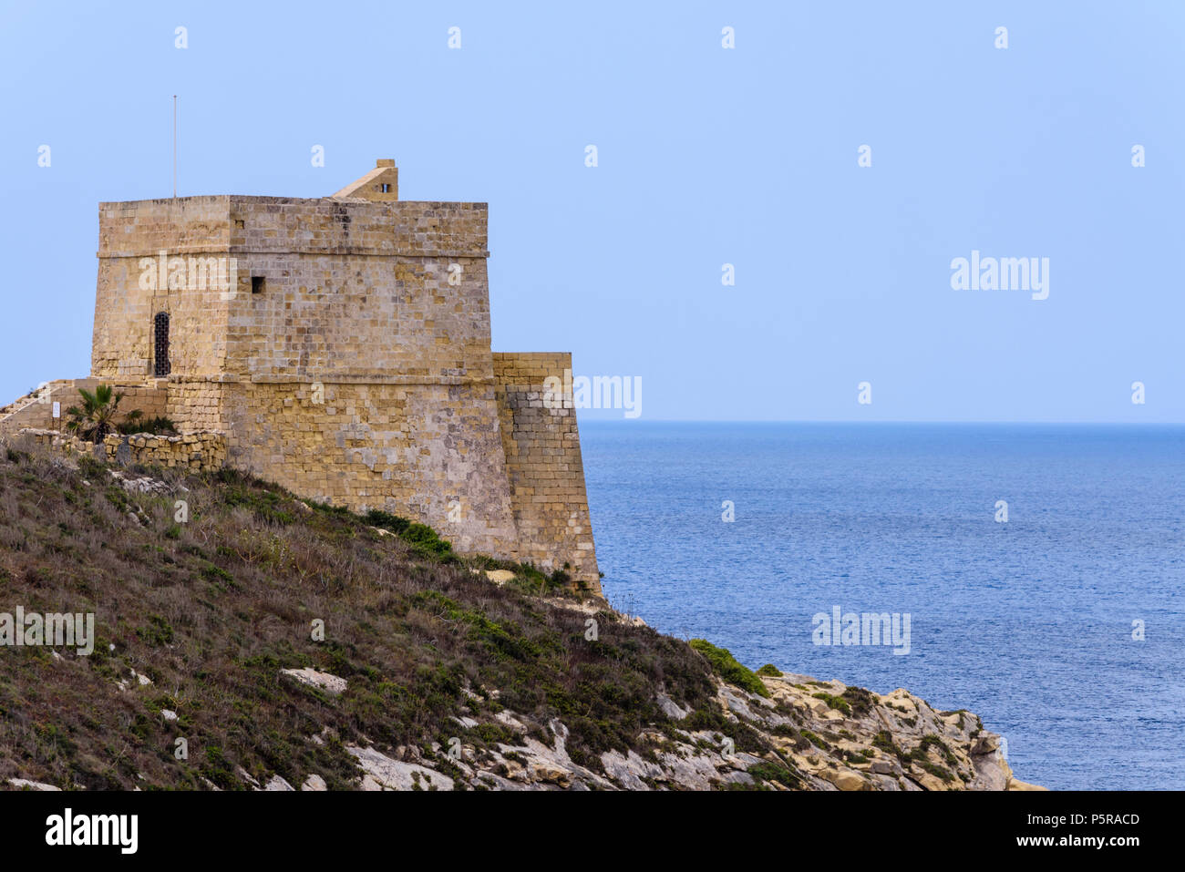 One of the many fortifications dotted around the coast of Gozo and Malta. Stock Photo