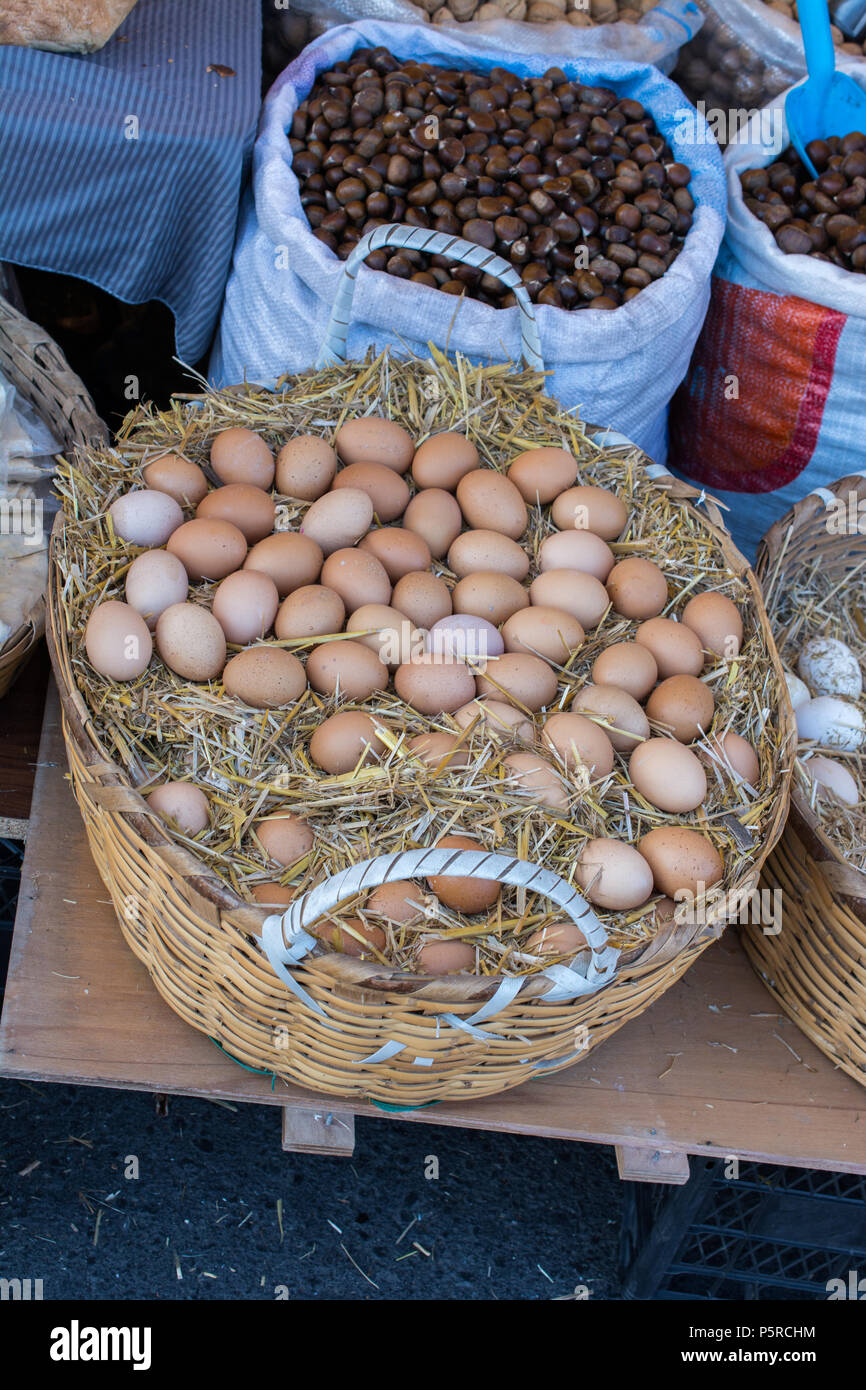 Organic fresh farm eggs in the straw basket Stock Photo - Alamy