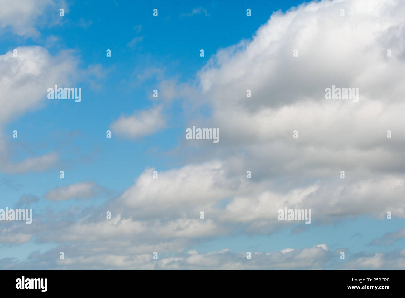 Sky background, clear blue skies with white cloud formation Stock Photo