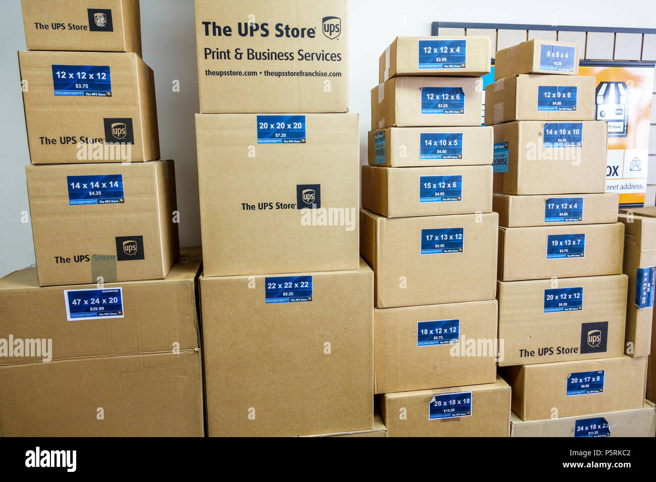 Miami Beach Florida,UPS Store,business,interior inside,shipping,printing services,stacked cardboard boxes,different sizes,FL171015001 Stock Photo