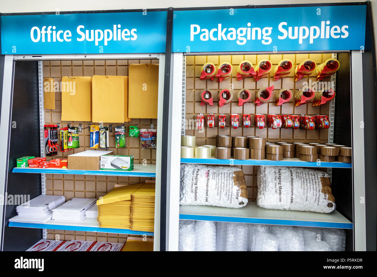 Miami Beach Florida,UPS Store,business services,interior inside,shipping,packing office supplies,yellow envelopes,tape,display sale shelves,FL17101500 Stock Photo