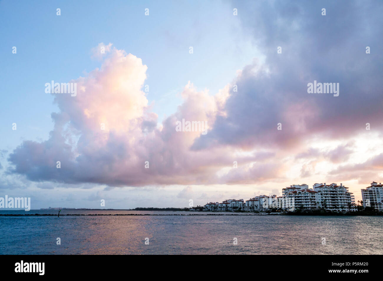 Miami Beach Florida,Fisher Island,Government Cut,Atlantic Ocean,water,city skyline,cumulonimbus cloud,backlit sunset,sky,FL171015008 Stock Photo