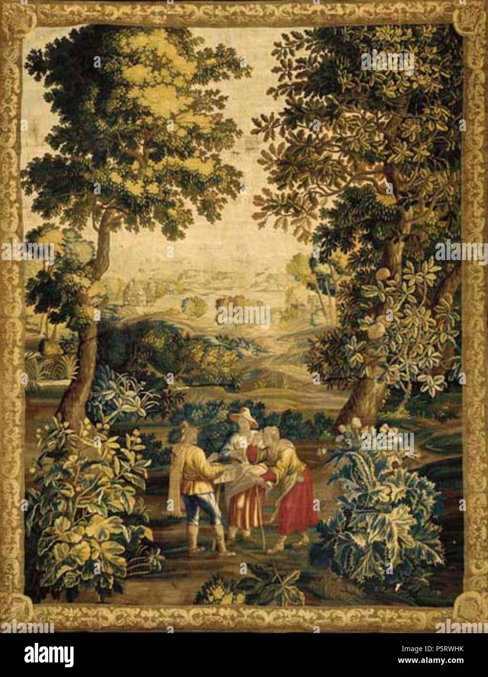 English: An Oudenaarde Teniers Tapestry depicting Le Marchand des Lunettes,  with an eyeglass vendor with two maidens within an open landscape  surrounded by a foliate scrolling border with blue outer slip Early