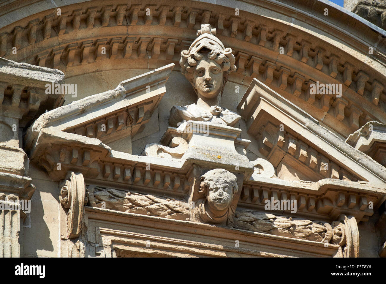 head of minerva detail of classical architectural stone carving on the roman baths complex Bath England UK Stock Photo