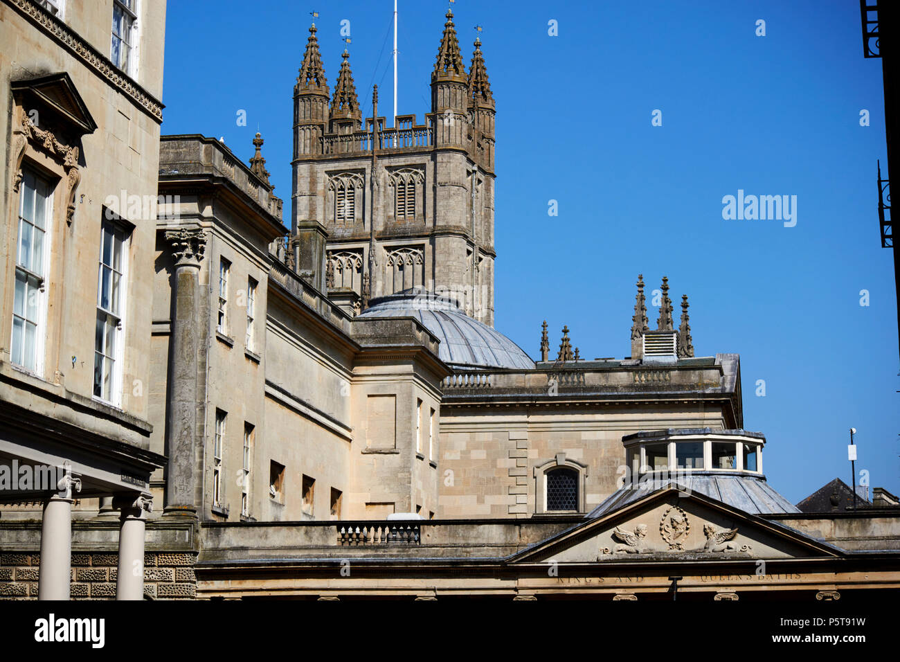 the roman baths complex in front of gothic bath abbey and behind georgian terrace Bath England UK Stock Photo