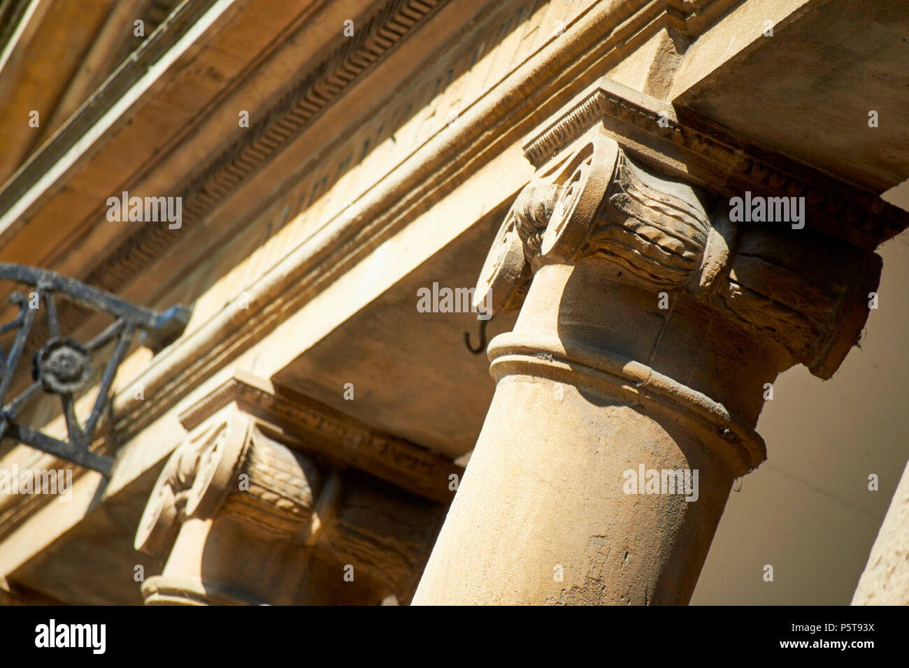 Ionic columns detail of classical architectural stone carving on the roman baths complex Bath England UK Stock Photo