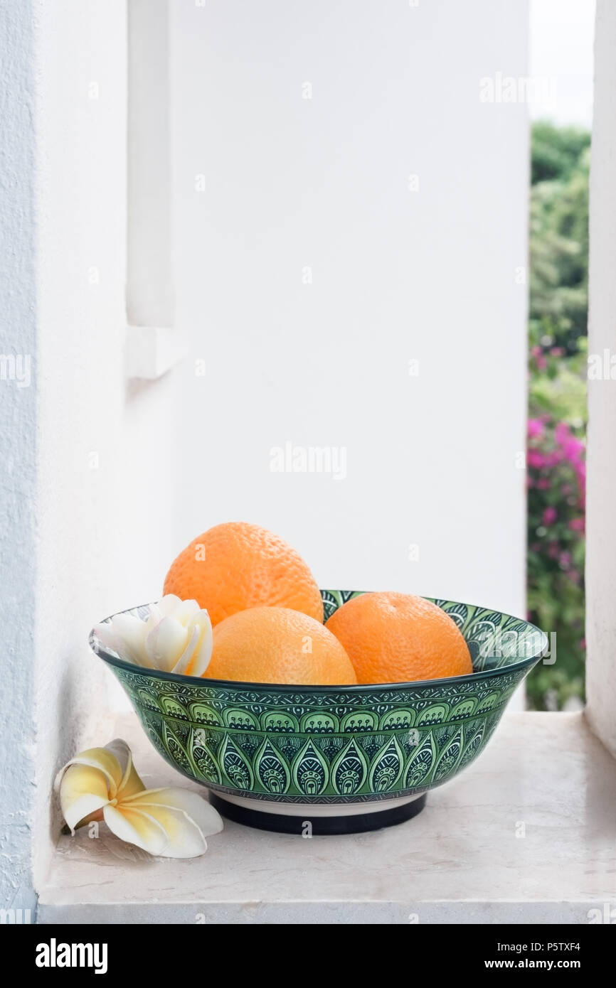 Organic ripe oranges in Greek pot Stock Photo