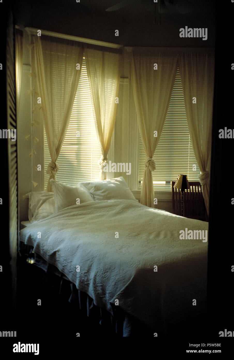 Cool Coastal Bedroom With Bed With White Linen In Front Of