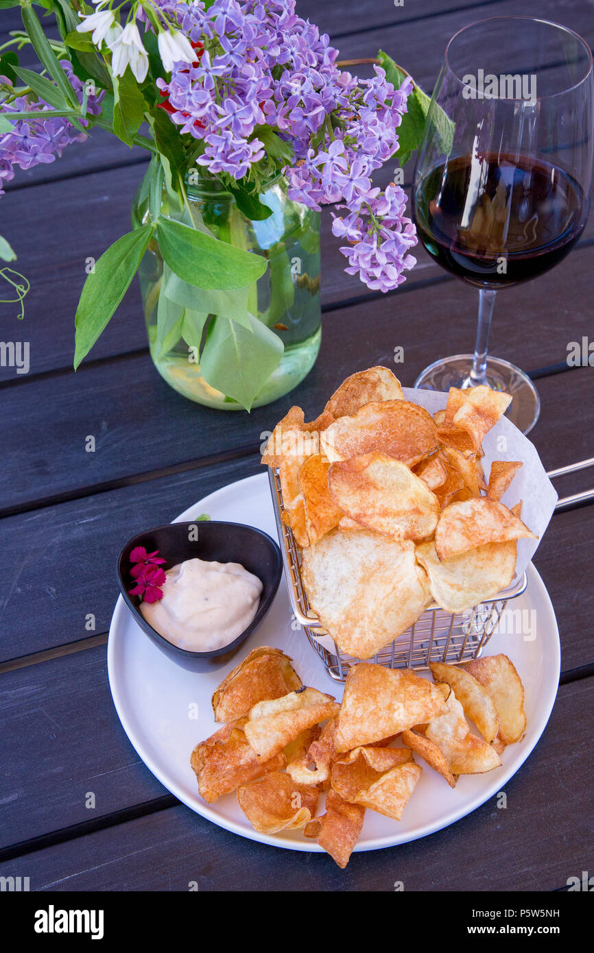 Potato chips and red wine in Sonoma. Stock Photo