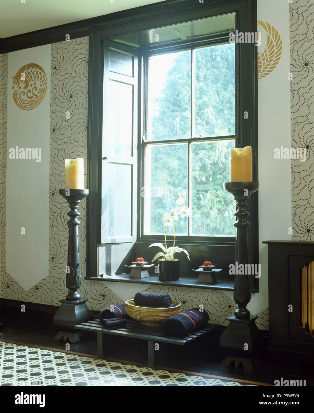 Large Candles In Giant Sized Candlesticks On Either Side Of