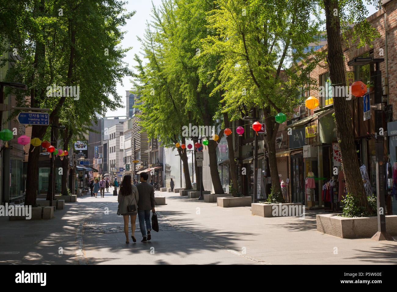 A couple walking down the street in Insadong, Seoul, South Korea. Stock Photo