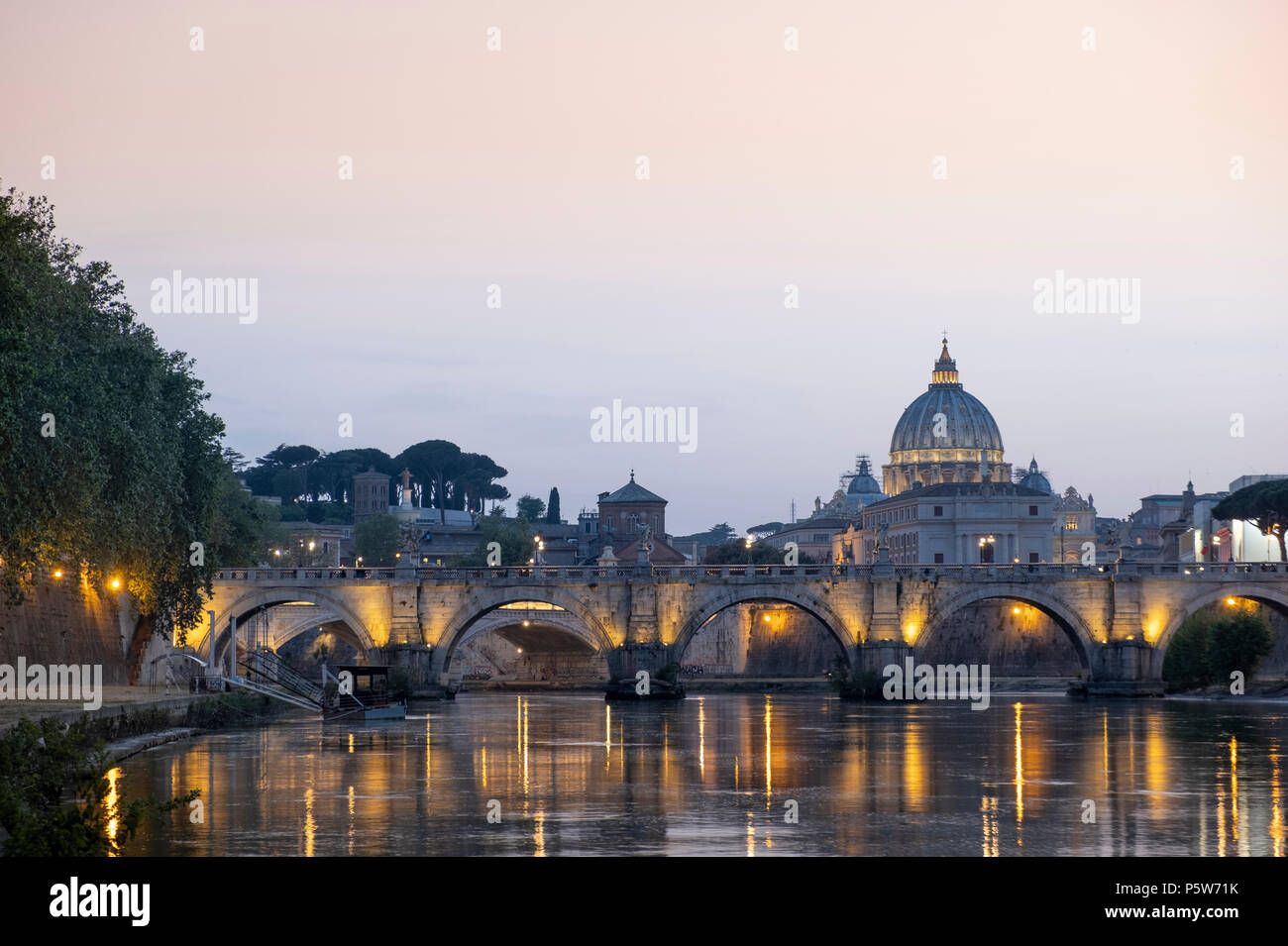 The dome of St. Peter's church and St. Angelo bridge in the historical centre of Rome Stock Photo