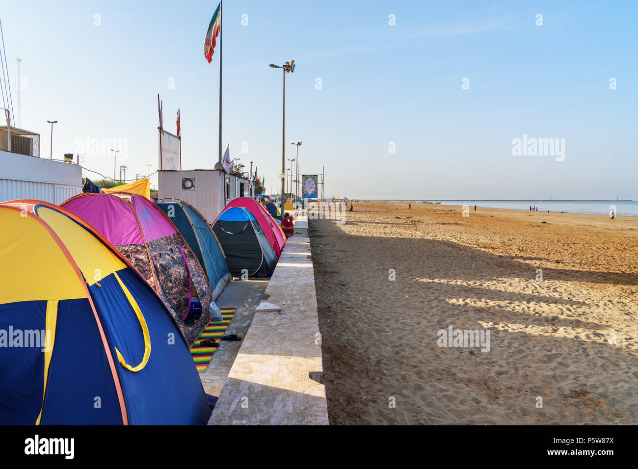 Bandar Ganaveh, Bushehr Province, Iran - March 27, 2018: Iranian travelers living in tents on the beach at Persian Gulf. A lot of Iranians traveling d Stock Photo