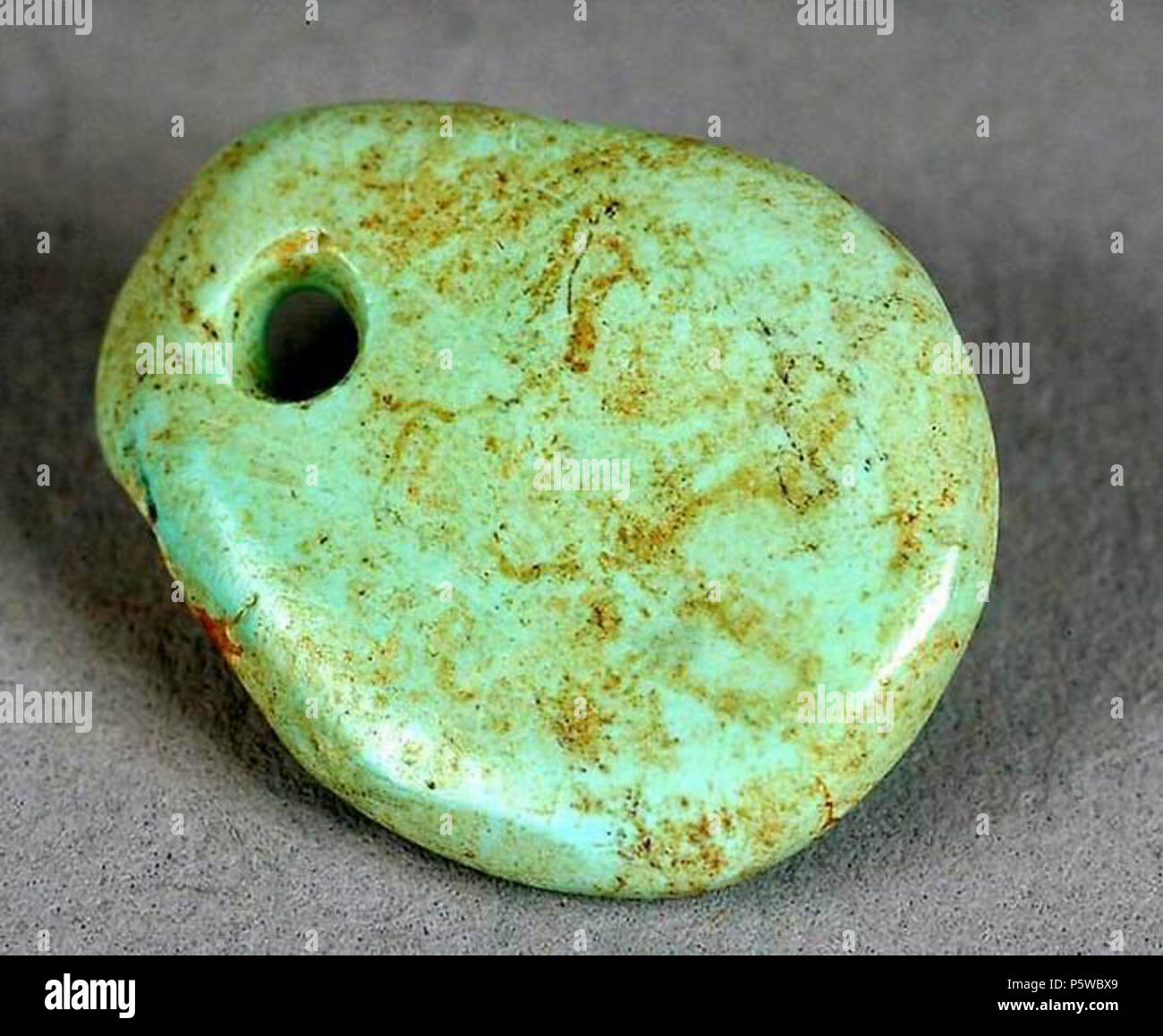 N/A. Ancestral Puebloan (Anasazi) freeform turquoise pendant, circa  1000-1040 CE. L 1.3, W 1.0, T 0.2 cm. Site number 29SJ 626. Chaco Culture  National Historical Park, CHCU 30634. Uploaded by User:Hadal 10:52,