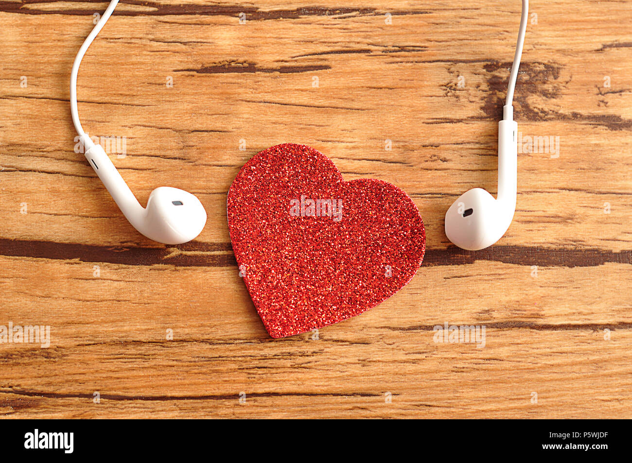White earphones with a red heart Stock Photo