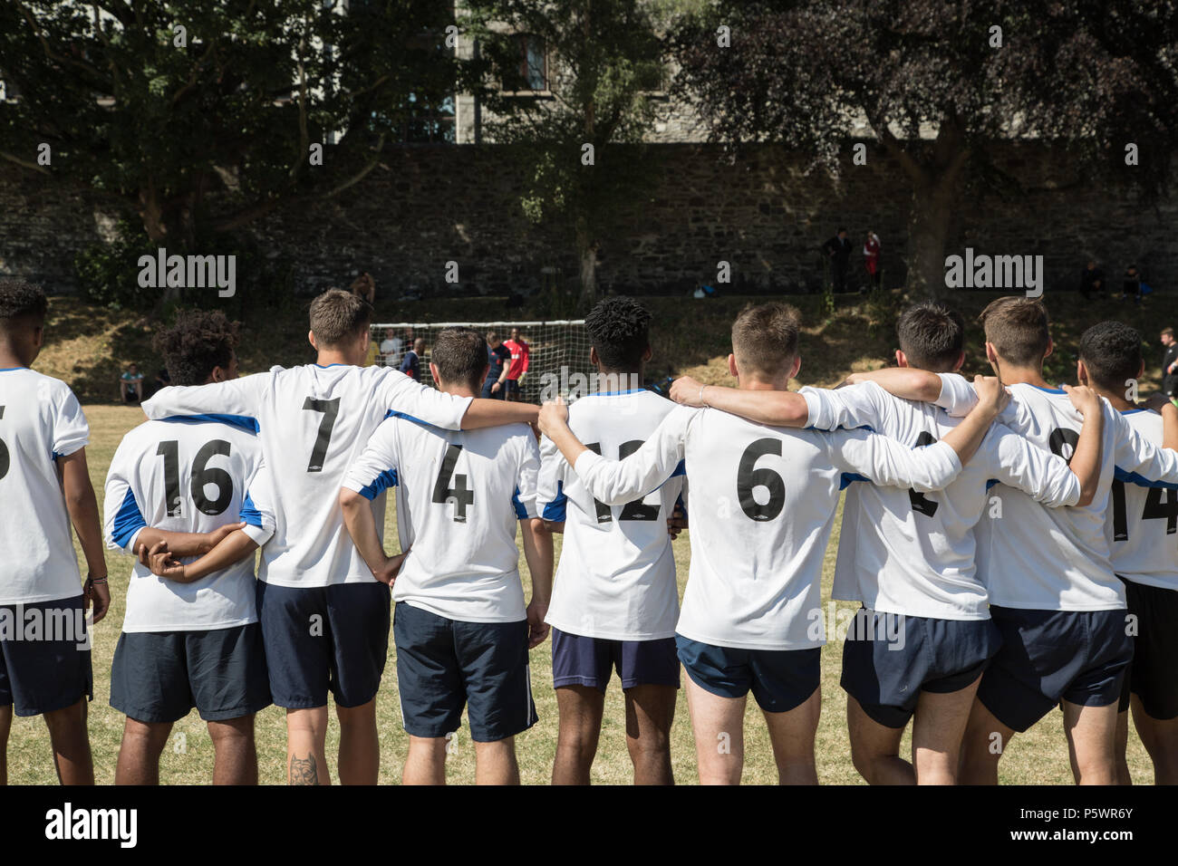 Football team watch penalty shoot out. Stock Photo