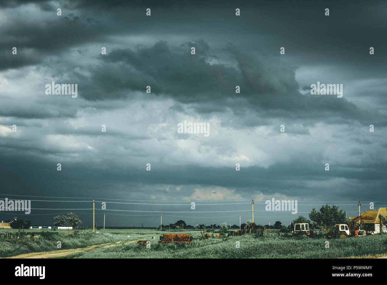 Gloomy thunderous rural landscape. Moody effect. Stock Photo