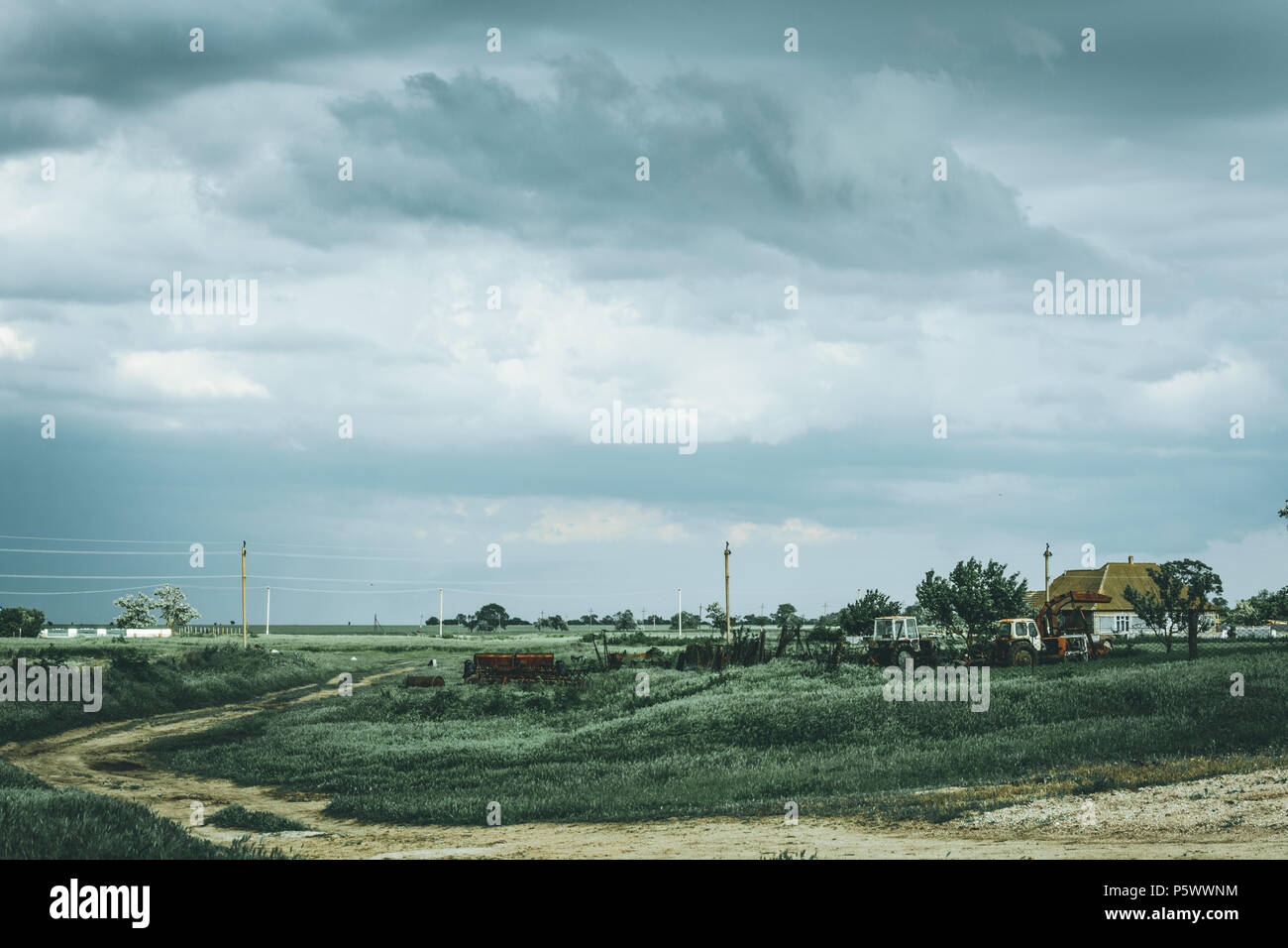 Gloomy thunderous rural landscape. Moody effect. Stock Photo