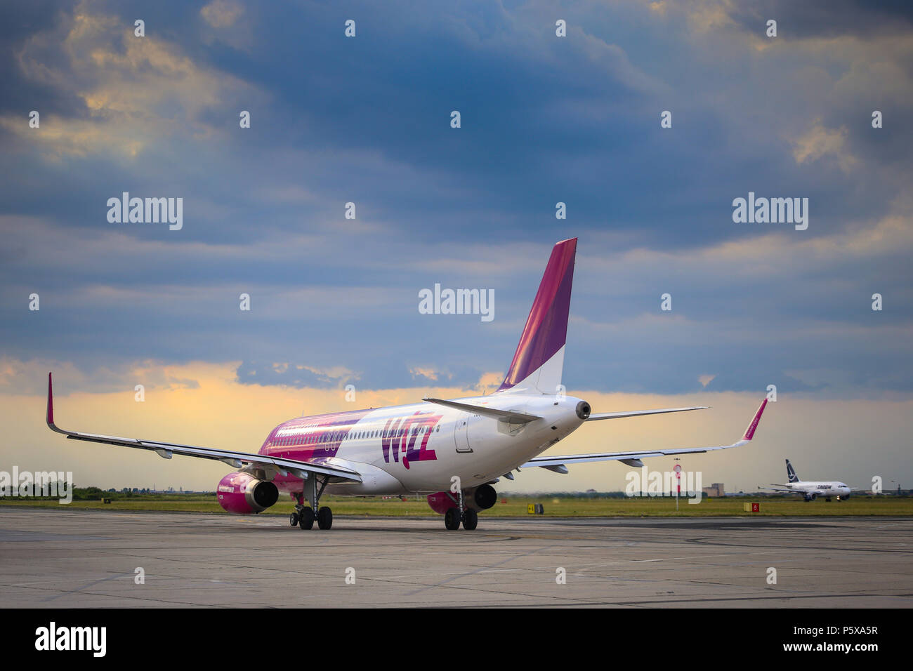 Commercial passenger jet airliner Airbus A320-232 (W) of the Hungarian low-cost Wizz Air Airline. Airplane is taxiing towards the runway ready for tak Stock Photo