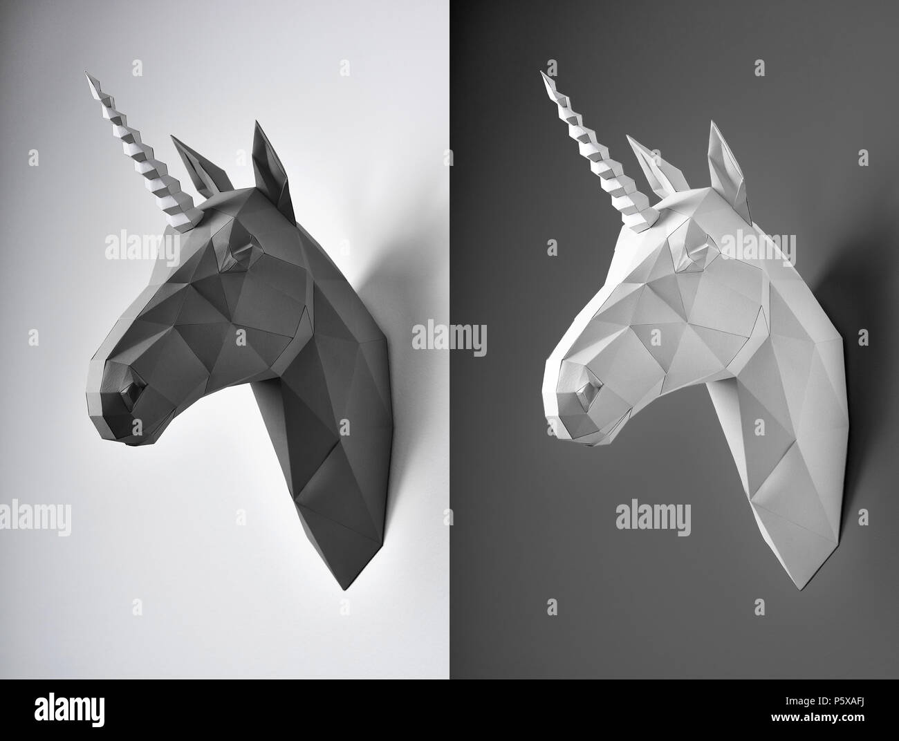 Two black and white unicorn heads on contrast background. Made from