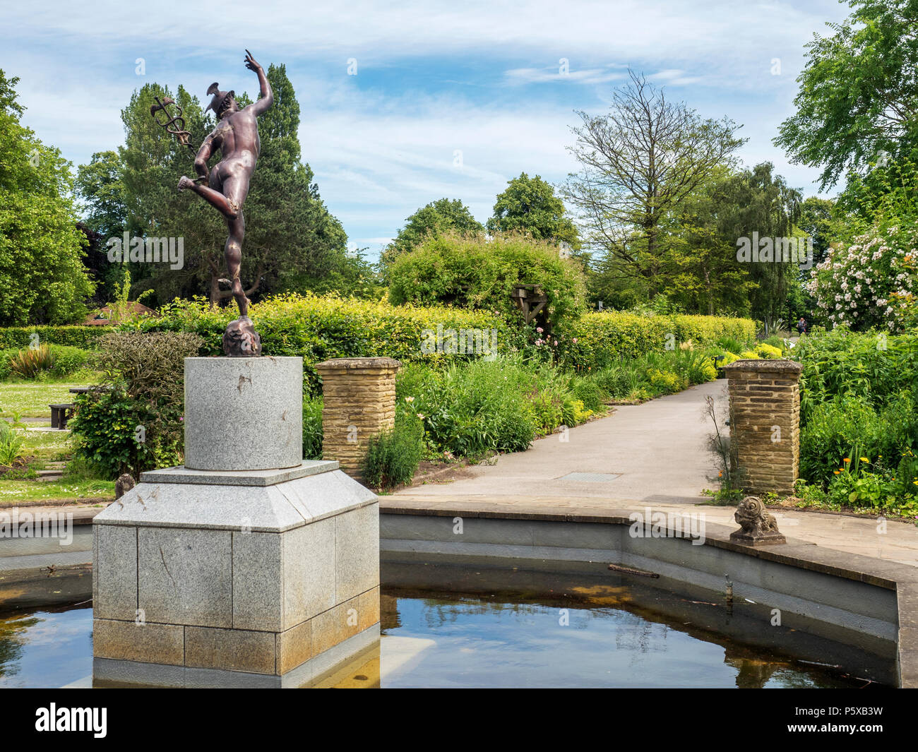 Pond with statue and herbaceous borders at Rowntree Park in York Yorkshire England Stock Photo