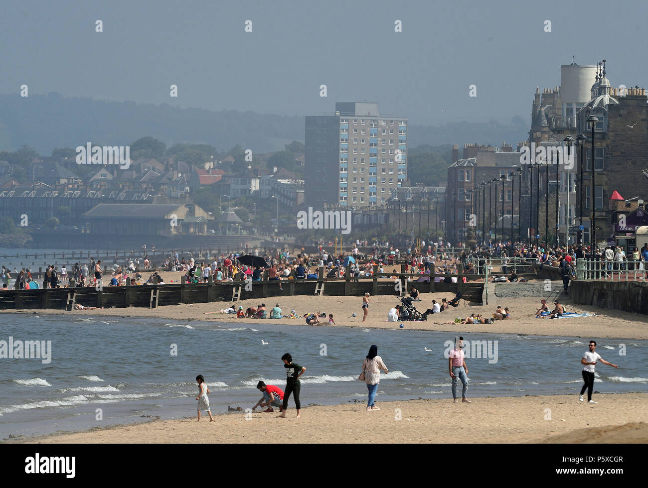 People enjoy the sunshine on Portobello beach, Edinburgh, as the hot