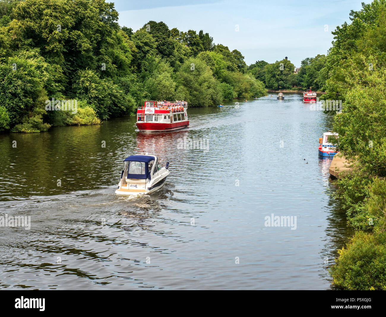Boats on the River Ouse in summer from Millennium Bridge York Yorkshire England Stock Photo