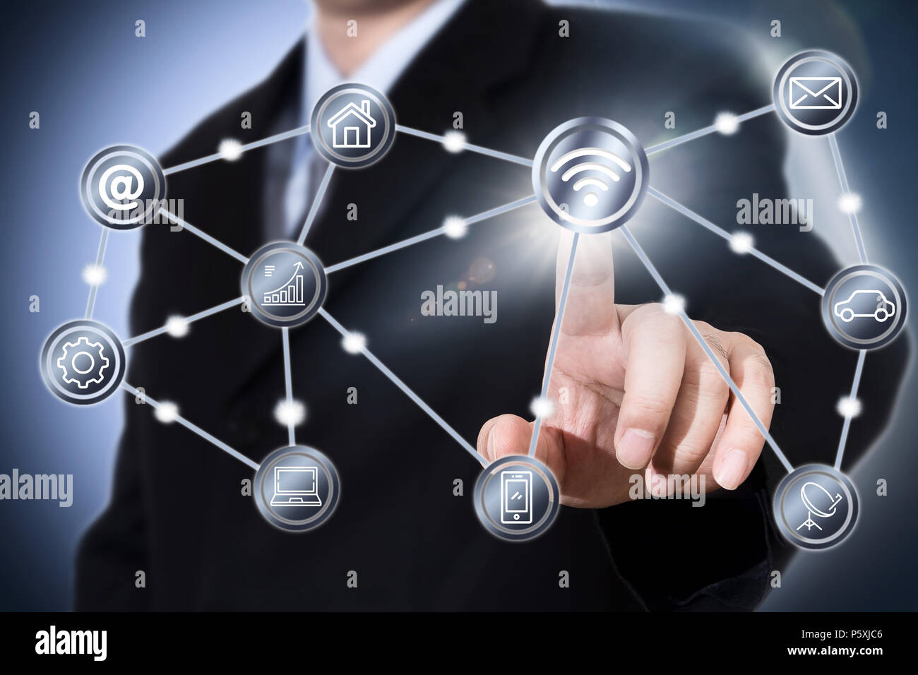 Businessman touching a wifi icon Stock Photo