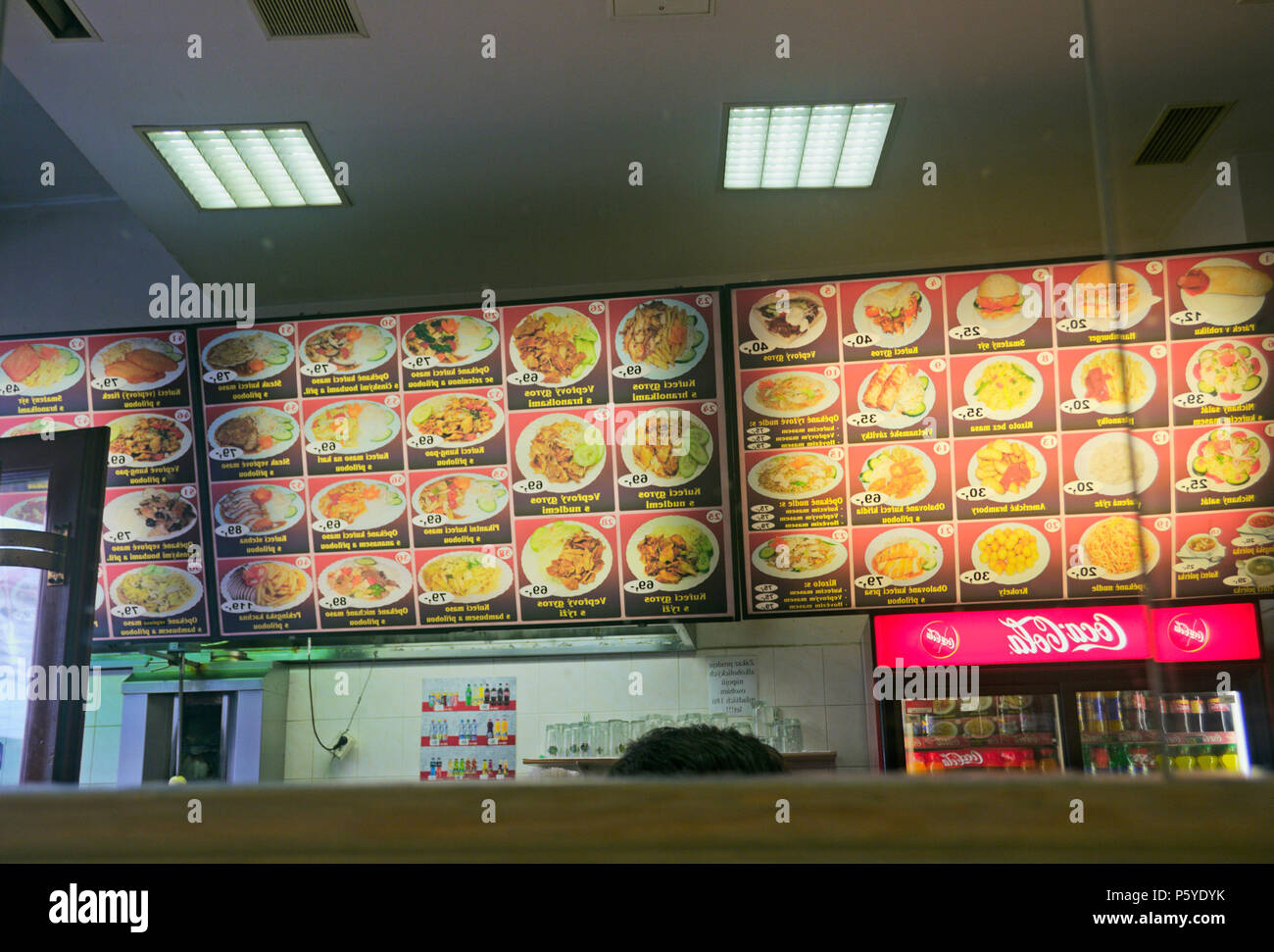 Asian fast food restaurant menu plates reflected on mirror, Brno, Czech
