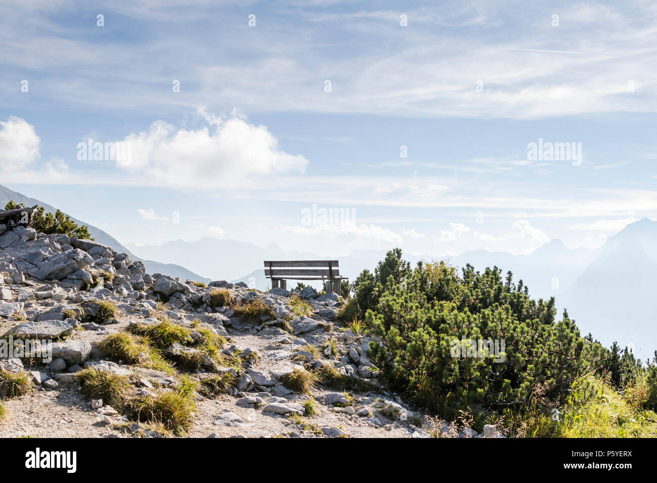 Empty park bench in high mountains, view from Eagles nest in the bavarian Alps near Berchtesgaden in Germany Stock Photo