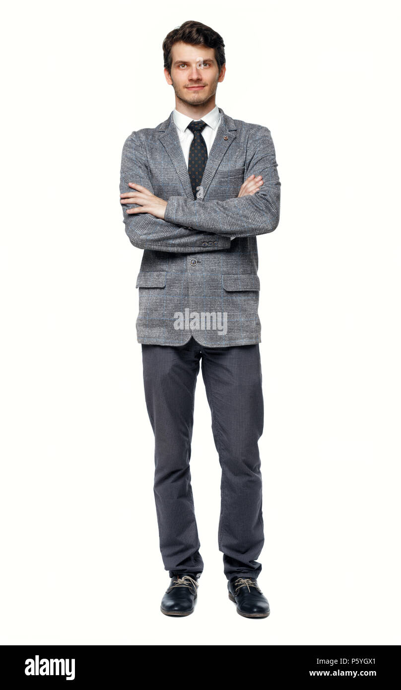 Smiling young businessman. Front view. A young specialist in a suit is  standing with his arms folded on his chest. Isolated over white background  Stock Photo - Alamy